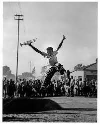 Hugh Masekela jumping for joy