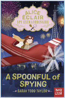 Small book cover image. Alice sits in a red monoplane with an open cockpit, with Casper the cat beside her. They dive through the skies over Paris, fireworks going off behind in the sky. Alice’s yellow scarf is streaming behind her.