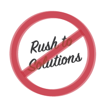 The words “Rush to Solutions” surrounded by a red circle with a slash through it.