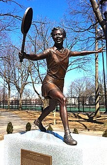 Bronze statue of Gibson doing a perfect backhand groundstroke.