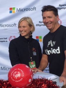 Special Olympics CEO Janet Froetscher, left, and Jeff Hansen, General Manager of Brand Studios for Microsoft Corporation celebrate the new partnership. 