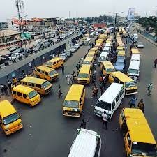 Typical Lagos garage showing danfos and commuters