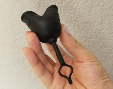 Black menstrual cup with pull tab