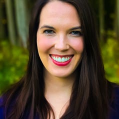 Dr. Johnson — A woman with medium length straight brown hair and black top smiling