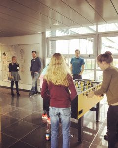 The girls playing table soccer during a break