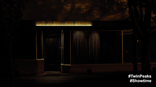 Nadine's store front lighting with Dr. Amp's golden shovel exhibit animated GIF