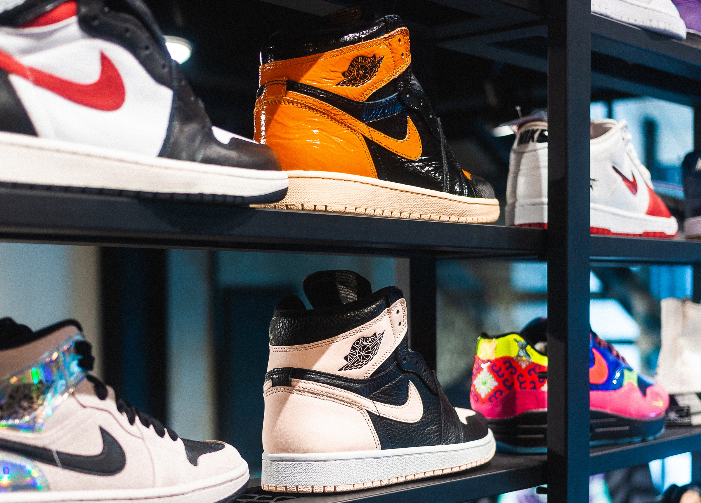 Various sneakers on shelves.