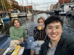 3 students on a small boat