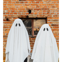 Two people dressed as ghosts wearing sheets
