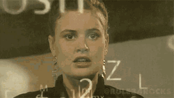 A gif depicting a confused looking woman