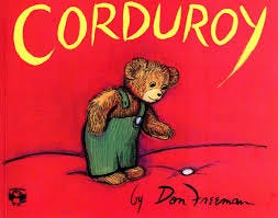 The cover of the book “Corduroy”, with a yellow title and red background. Corduroy is wearing green corduroy overalls.