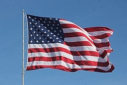 Image of the U.S. Flag being blown by the wind