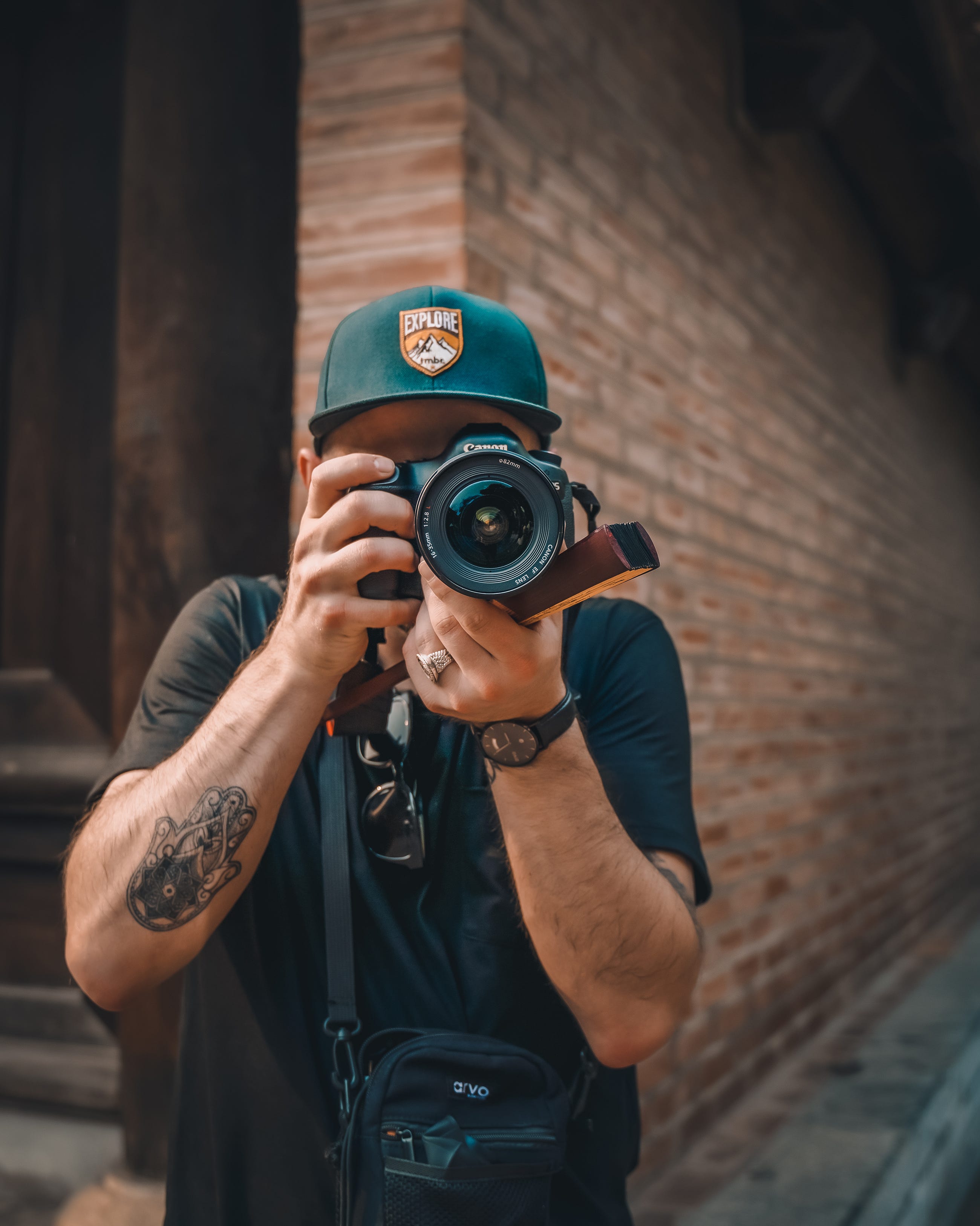 Photographer looking into the camera. Photographer unknown - Unsplash photos