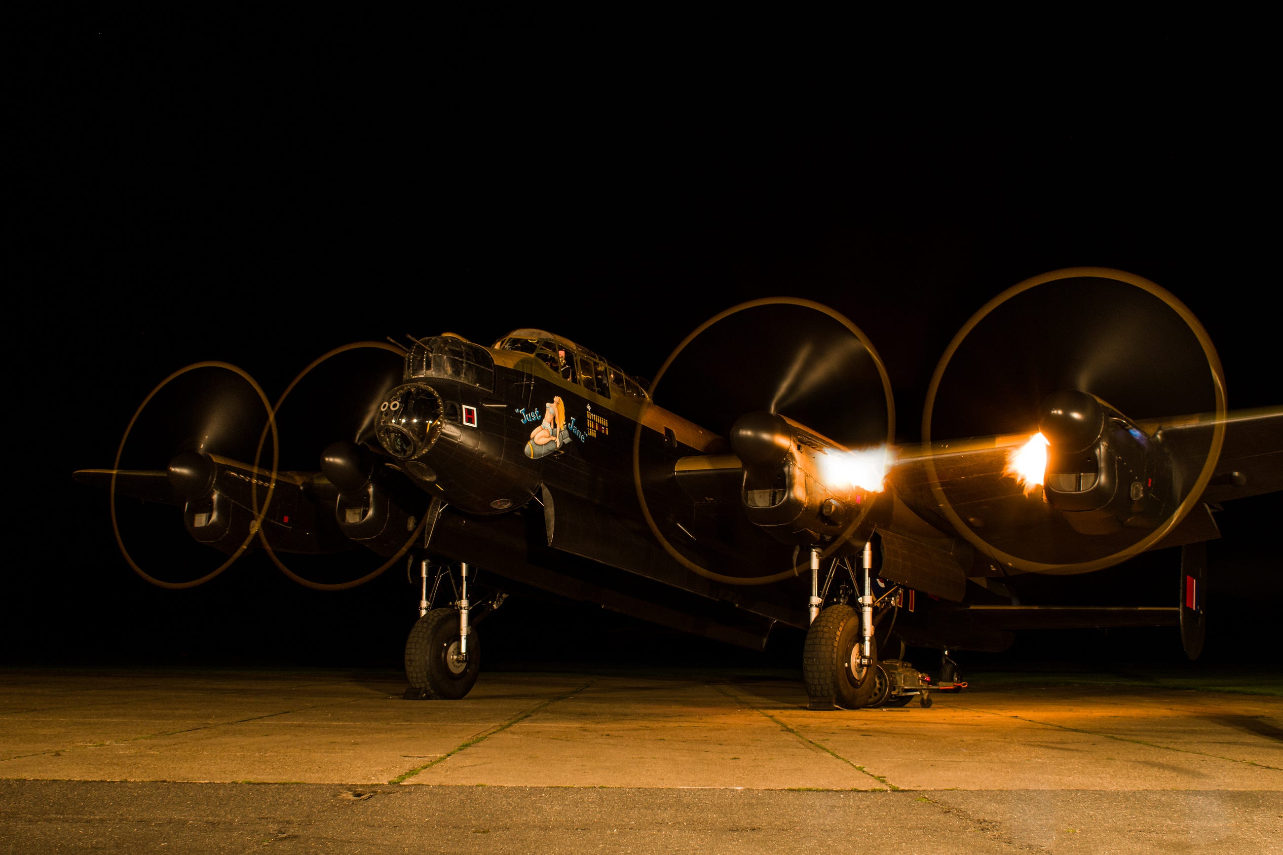 Flames Shoot From the Engines of a Vintage WW2 Aircraft