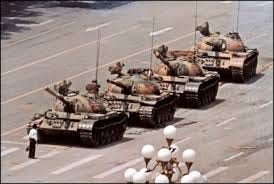 In front of Tiananmen Square,a man come to face off against four tank