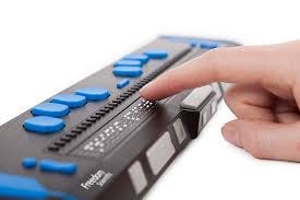 A finger feeling a refreshable braille display