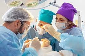 a team of doctors engaged in hair transplant procedure