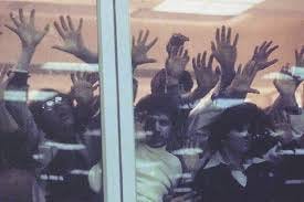 Zombies trying to get in to a shopping mall