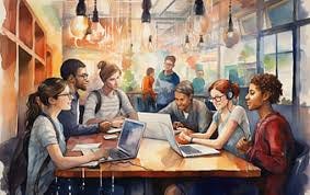 A group of people collaborating at a table with their laptops.