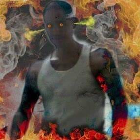 A photo of Leonard he used graphics to make his eyes glow. Smoke is shooting out his ears and flames surround him. He is wearing a wifebeater. Heights, Houston, Tx. ‘09