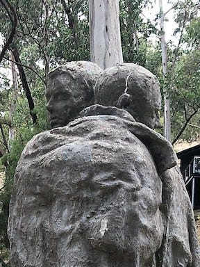 A sculpture of two men hugging