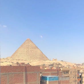 A pyramid against a clear blue sky