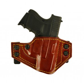 a brown leather holster with a black gun