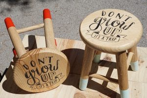 Refusing to grow up. Stool that says 'Don't grow up, it's a trap'