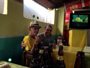 Tiago with a taxi driver after winning the pool