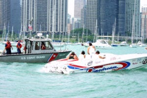 Military civilian skills overlap. Coast Guard next to civilian boat.