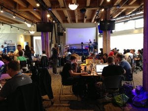 Hackers listen to Jon LeBlanc at Battle Hack Seattle