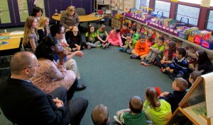 First-grade students in Michelle Hopp’s and Suzanne Delfino’s Marlton Elementary School classroom greet each other and their visitors, Superintendent John Scavelli and his protégés for the day.