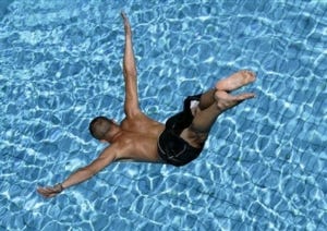 man diving into water