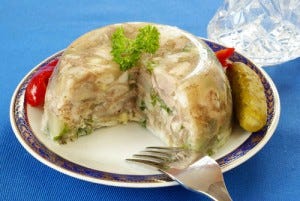 Pihtije, or jellied pork, is made by boiling meat with vegetables and spices.