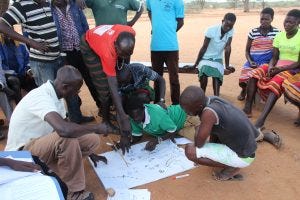 Community members participating in a resource mapping exercise