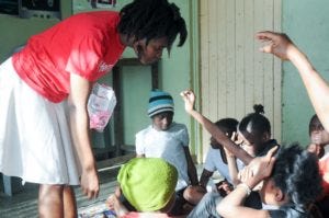 Judith engaging with students during a question and answer session of the Twaweza MHM programme, last year