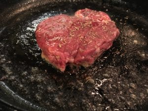 reasons to cook with a cast iron steak