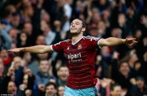 Andy Carroll celebrates after heading West Ham level four minutes before half-time.