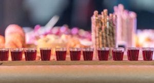 a row of small plastic communion cups