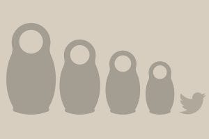 Gray Russian nesting dolls, with the Twitter logo on the right -- the image from the Rolling Stone article