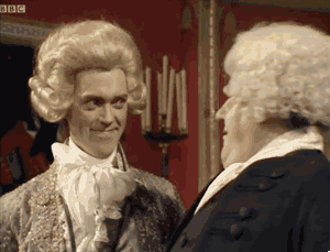 I think this one’s from Black Adder??? Two white men with curly, powdered white wigs dating back to the 18th century are chatting with each other. One smiles awkwardly as the graphic says, “Nope, didn’t catch any of that.”