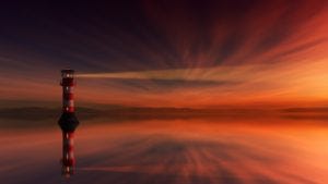 A lighthouse at sunset