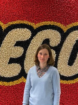 Photo of Mathilde in front of the LEGO Group logo