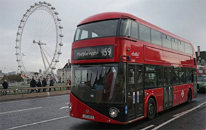 A bus in London with the London Eye in the background