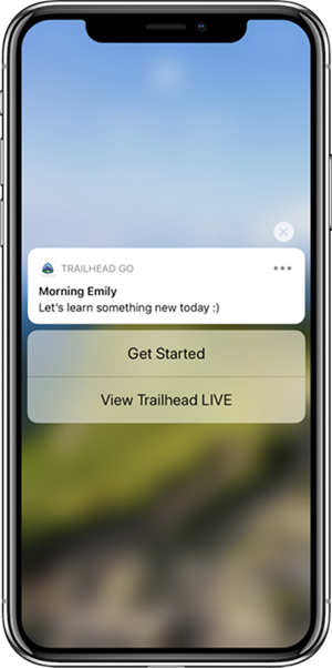 Mobile phone screenshot of a new notification via Trailhead GO. “Morning Emily. Let’s learn something new today :)”