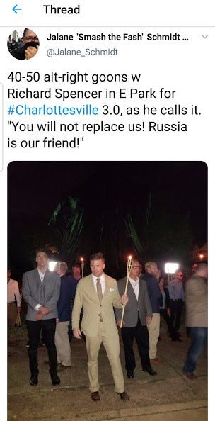 Angry white supremacists, carrying lit torches, conduct nighttime rally in Charlottesville, Virginia’s downtown park.