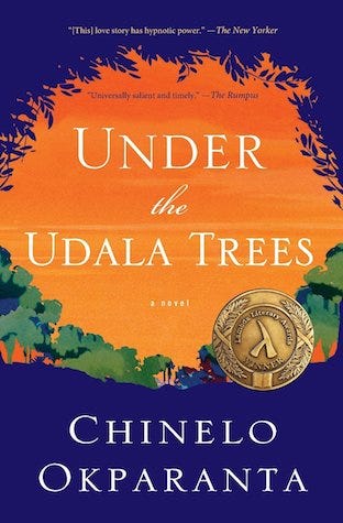 The book cover of Chinelo Okparanta’s novel, Under the Udala Trees. The cover is an artistic view looking up at a sky through a ring of trees. There is also a Lambda Literary Award Winner medal on the cover.