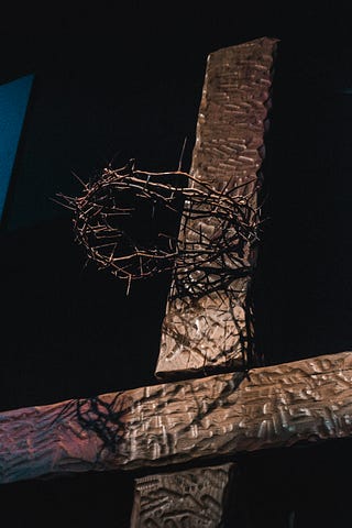 Wooden cross with crown of thorns
