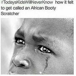 A photo of a crying black kid with the caption #TodaysKidsWillNeverKnow how it felt to be called an African booty scratcher.