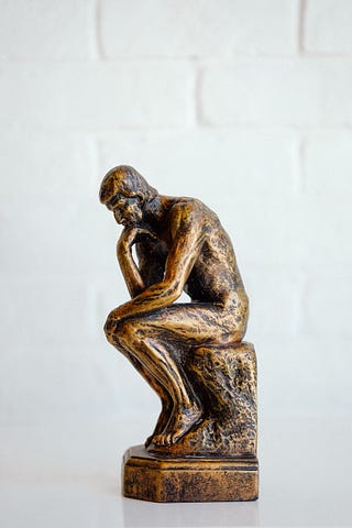 Bronze staue of a thinking man